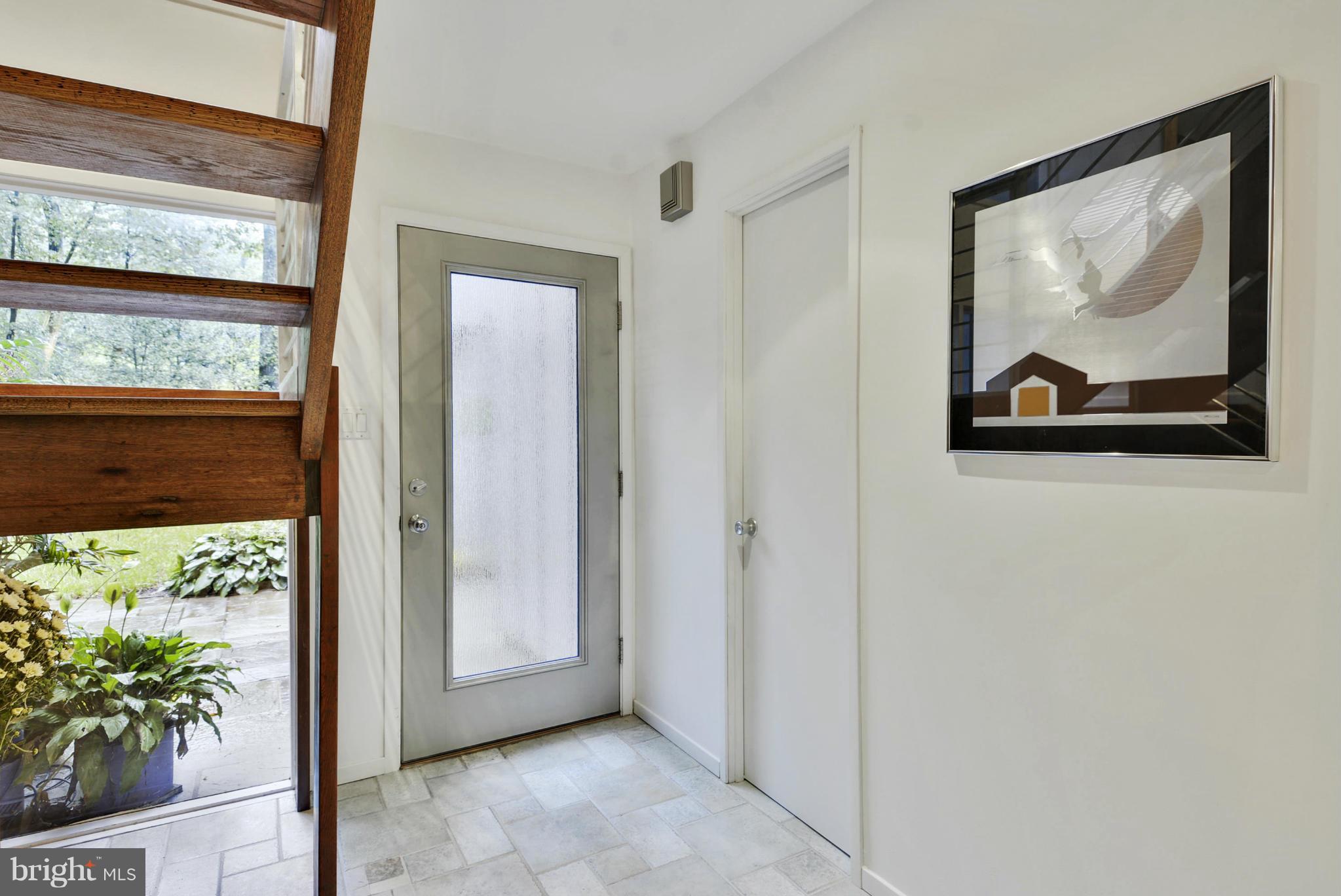 2600 Tack Lane Reston, VA 20191 - Photo 4 of 30 a view of a hallway with a painting on the wall