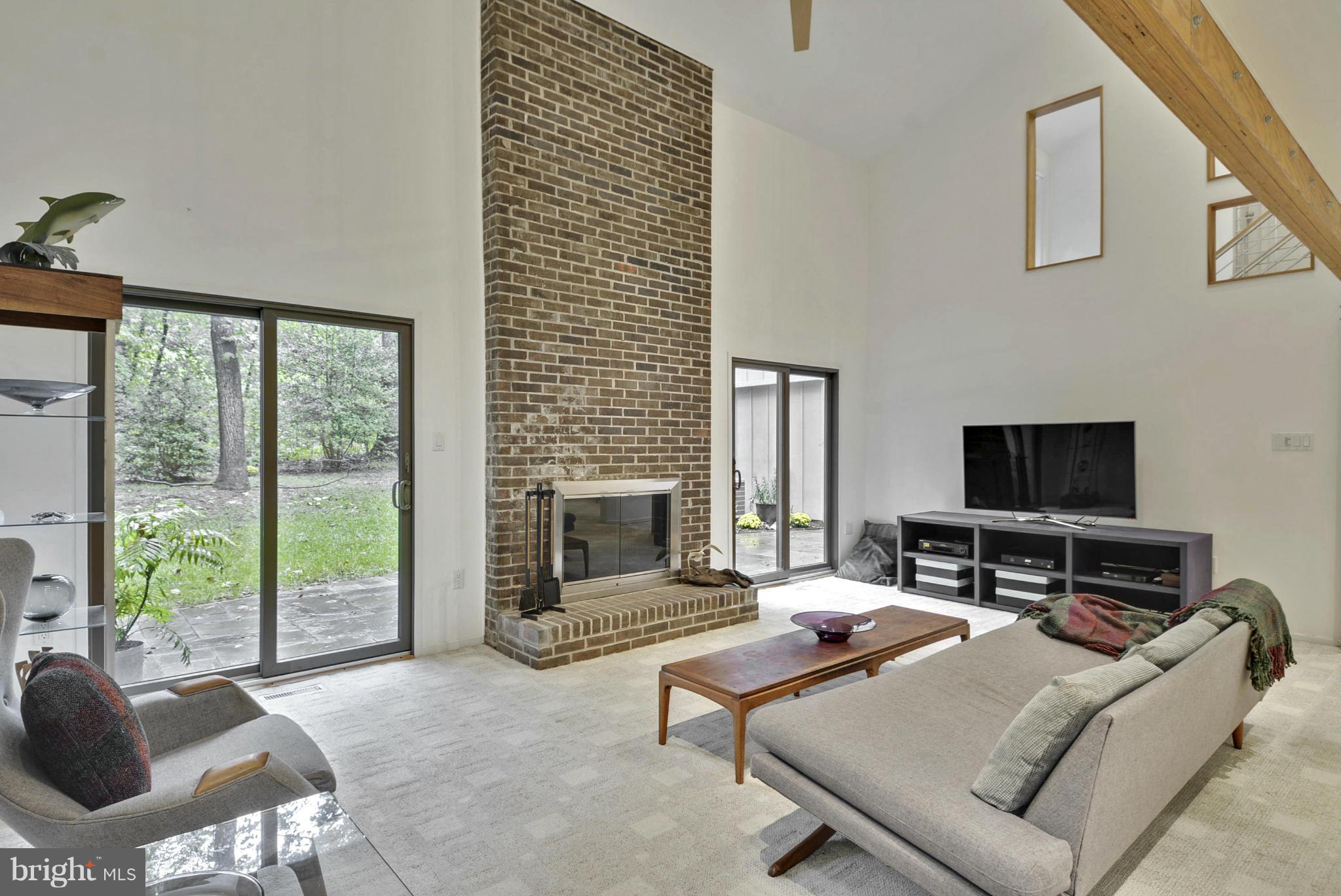 2600 Tack Lane Reston, VA 20191 - Photo 9 of 30 a living room with furniture a flat screen tv and a fireplace