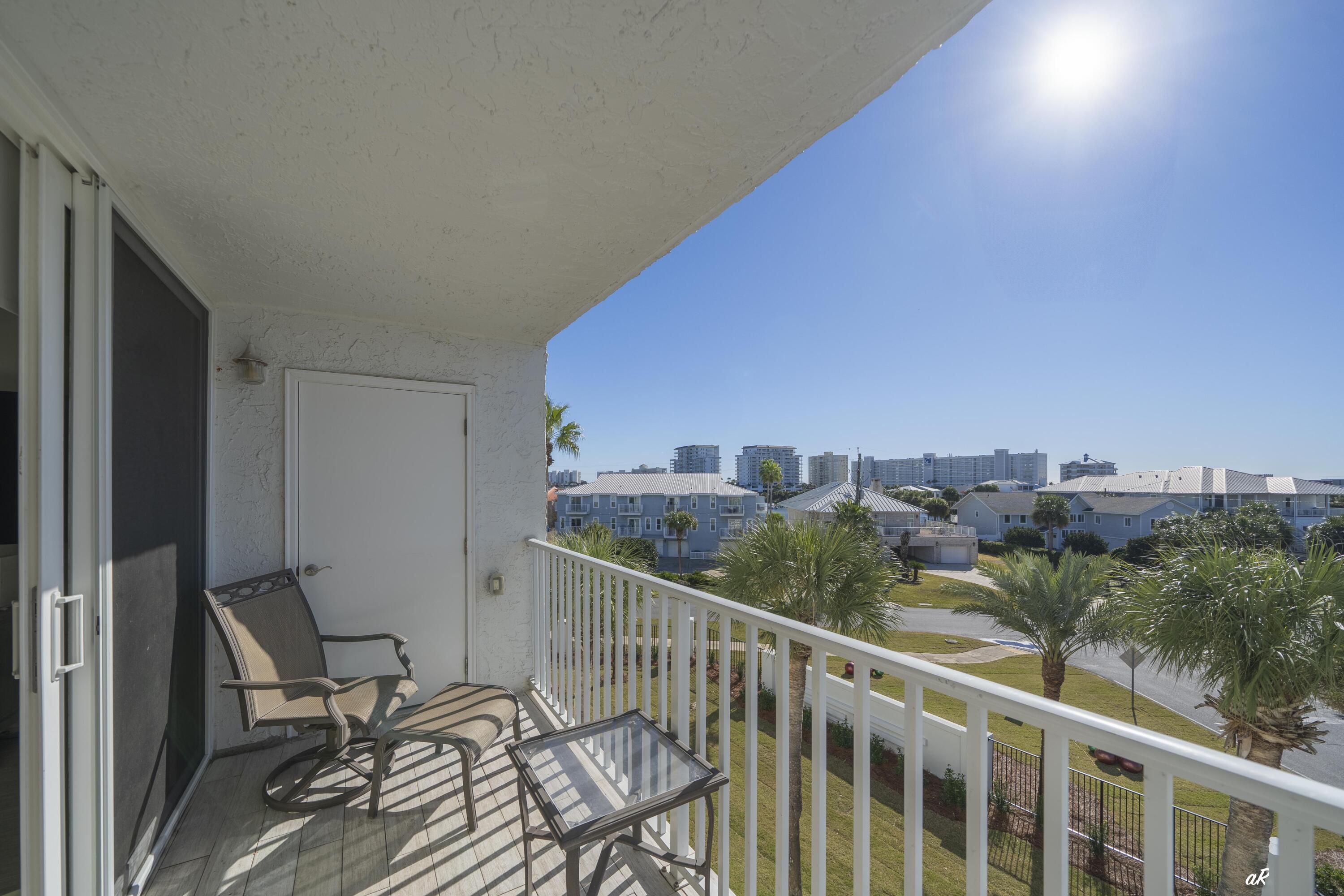 30 Moreno Point Road, Unit 404A Destin, FL 32541 - Photo 18 of 52 a view of a balcony with chairs