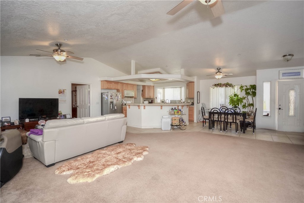 9331 Manada Road Phelan, CA 92371 - Photo 12 of 38 a living room with furniture and a flat screen tv