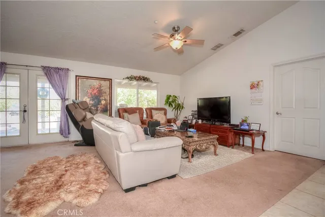 a view of a livingroom with furniture and a window