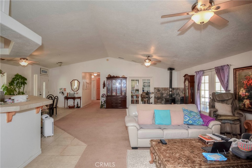 9331 Manada Road Phelan, CA 92371 - Photo 19 of 38 a living room with furniture and a flat screen tv