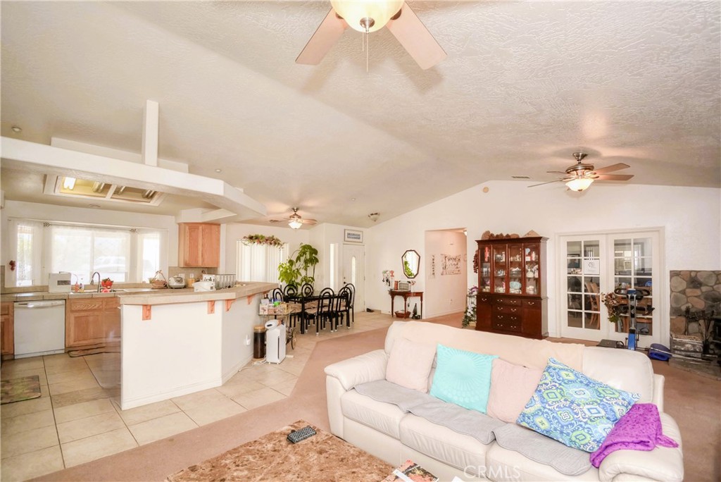 9331 Manada Road Phelan, CA 92371 - Photo 20 of 38 a living room with furniture and kitchen view