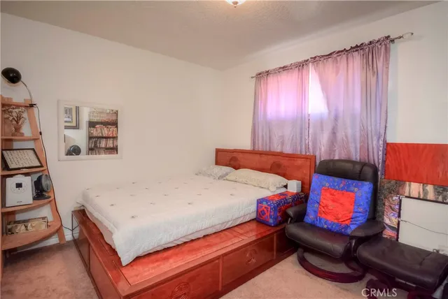 a bedroom with a bed and a closet