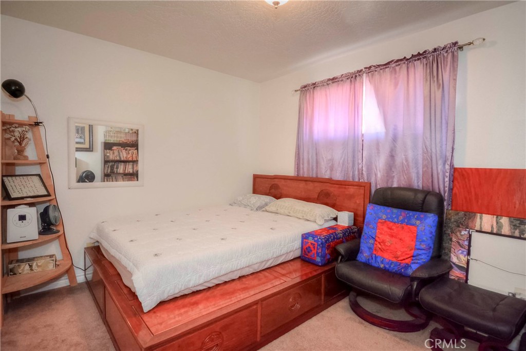 9331 Manada Road Phelan, CA 92371 - Photo 23 of 38 a bedroom with a bed and dresser