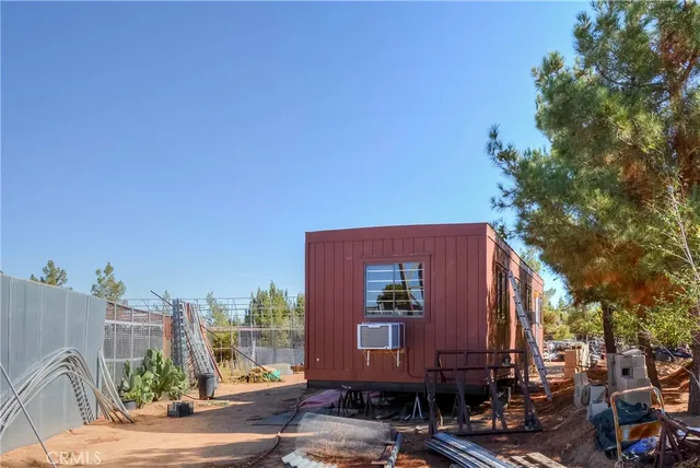 a view of a backyard with a sitting area