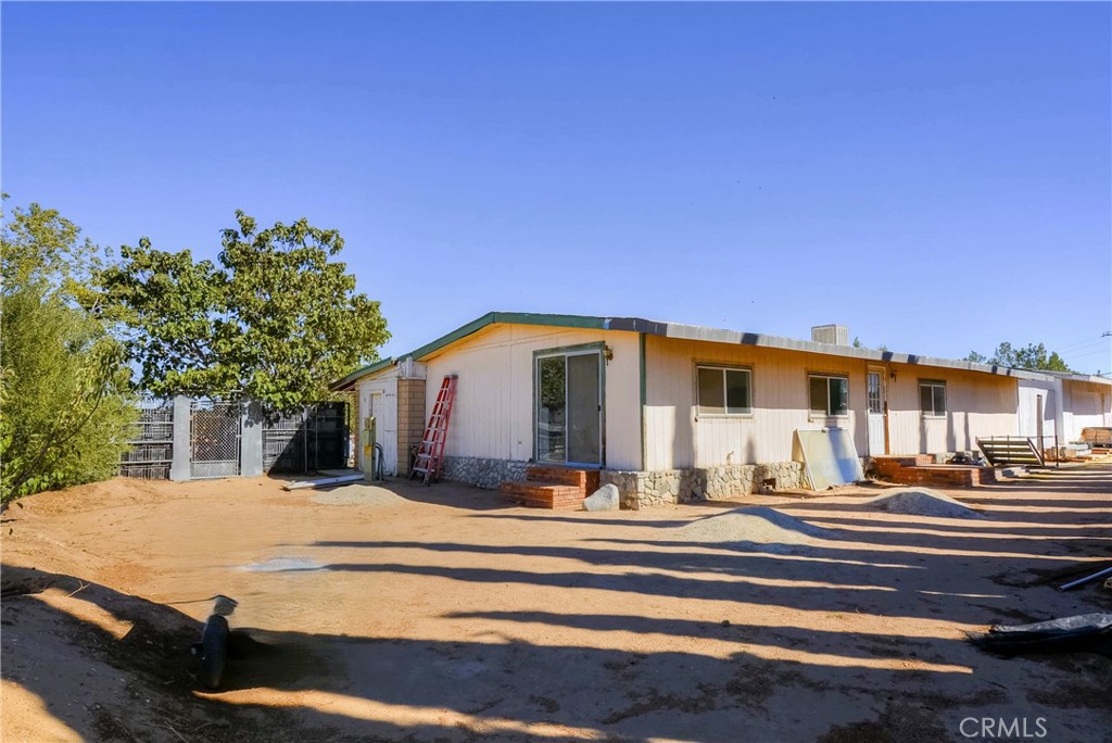 9331 Manada Road Phelan, CA 92371 - Photo 34 of 38 a view of a house with a patio