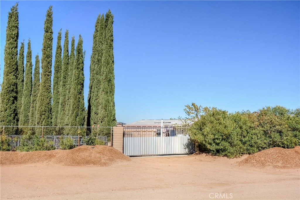 9331 Manada Road Phelan, CA 92371 - Photo 37 of 38 a view of a garden with a building in the background