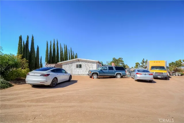 a view of a backyard with sitting area