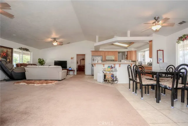 a kitchen with sink refrigerator and cabinets