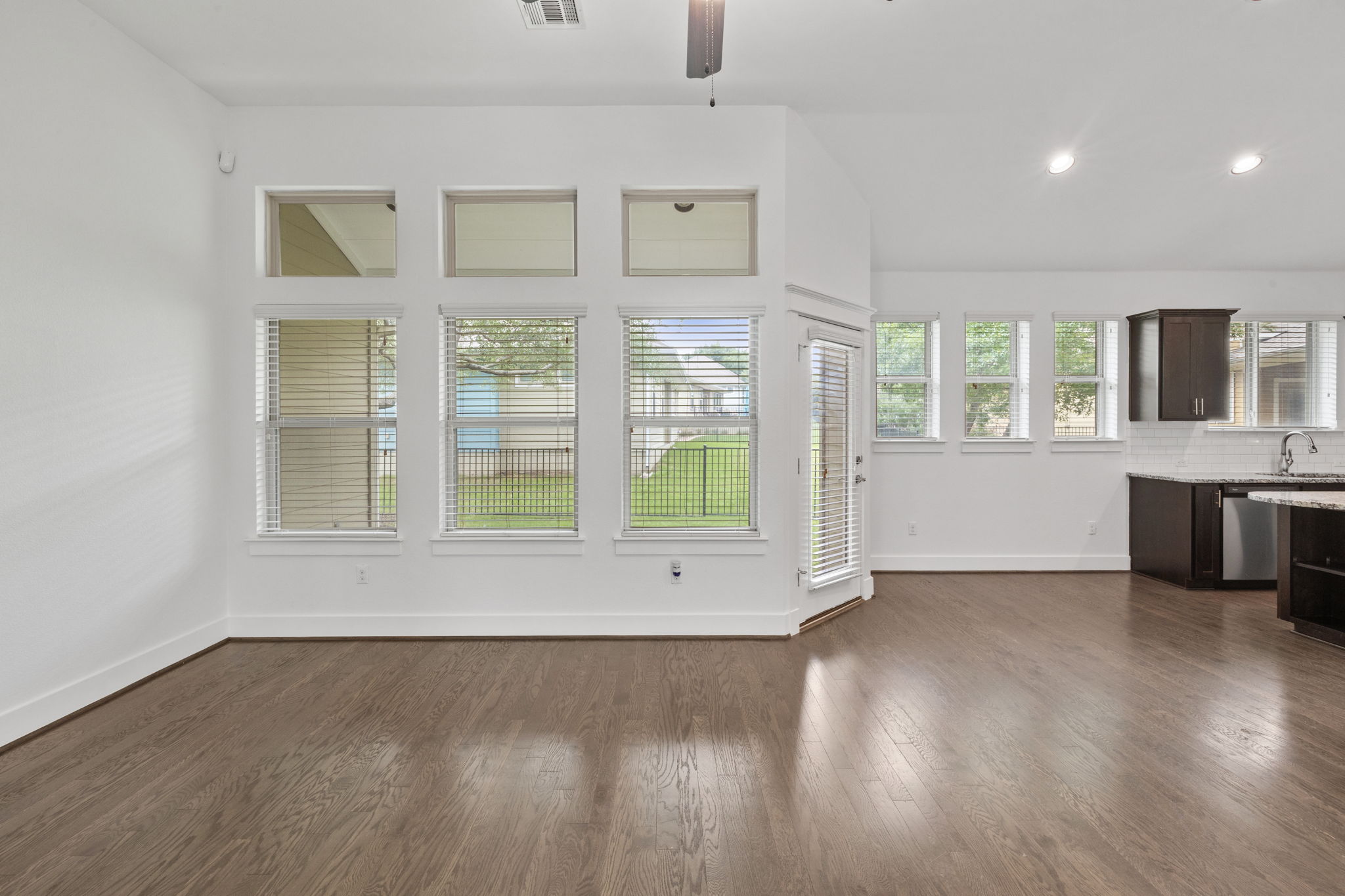 1765 Rowdy Loop, Unit 47 Leander, TX 78641 - Photo 11 of 39 Spacious interior with wood-finish flooring and white baseboards