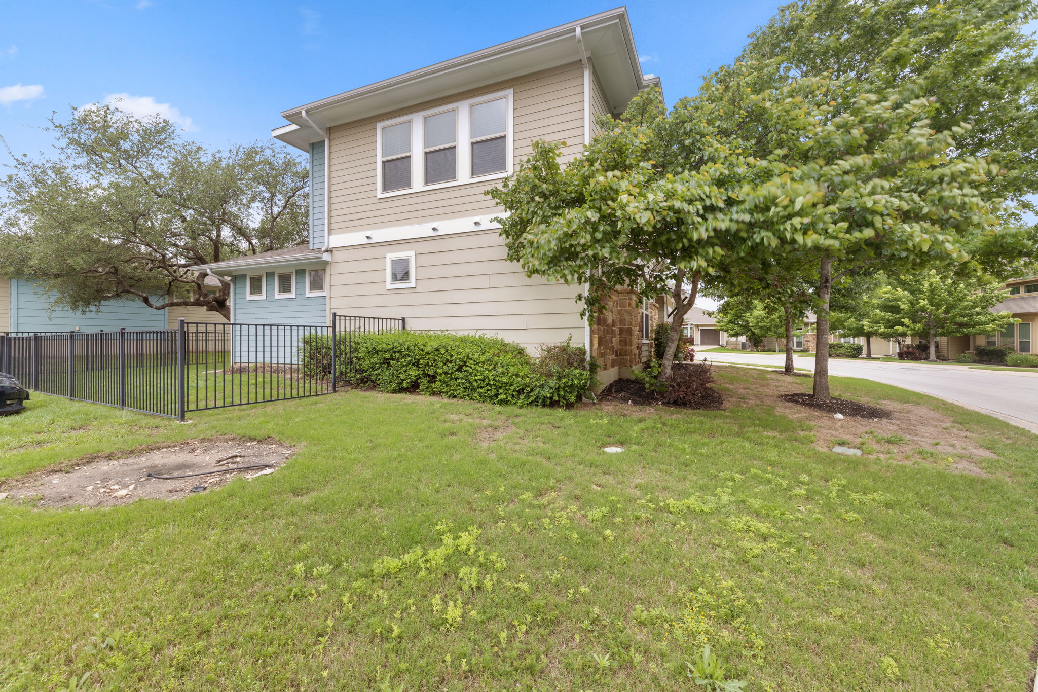 1765 Rowdy Loop, Unit 47 Leander, TX 78641 - Photo 39 of 39 Exterior featuring light-colored horizontal siding and a darker contrasting siding
