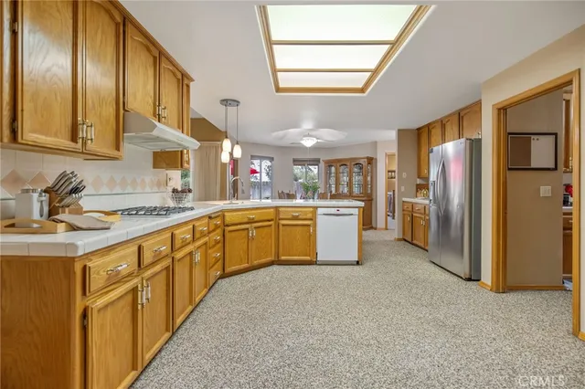 a kitchen that has a table and chairs in it