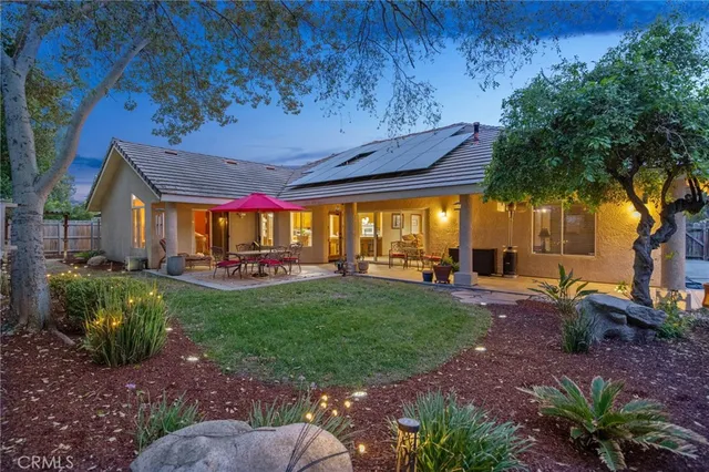 a swimming pool with outdoor seating yard and barbeque oven