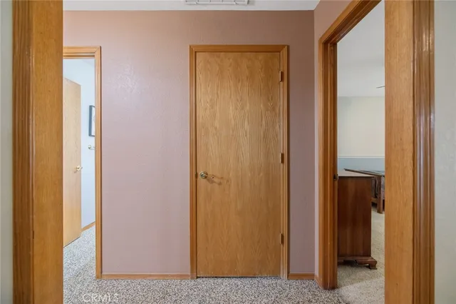 a view of a bedroom from a hallway