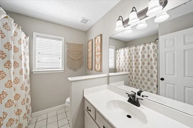 a bathroom with a sink double vanity and a shower