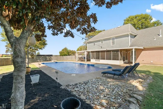 a front view of a house with swimming pool