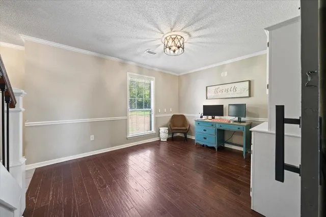 a view of room with window wooden floor and a ceiling fan
