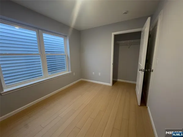 an empty room with a empty space and window