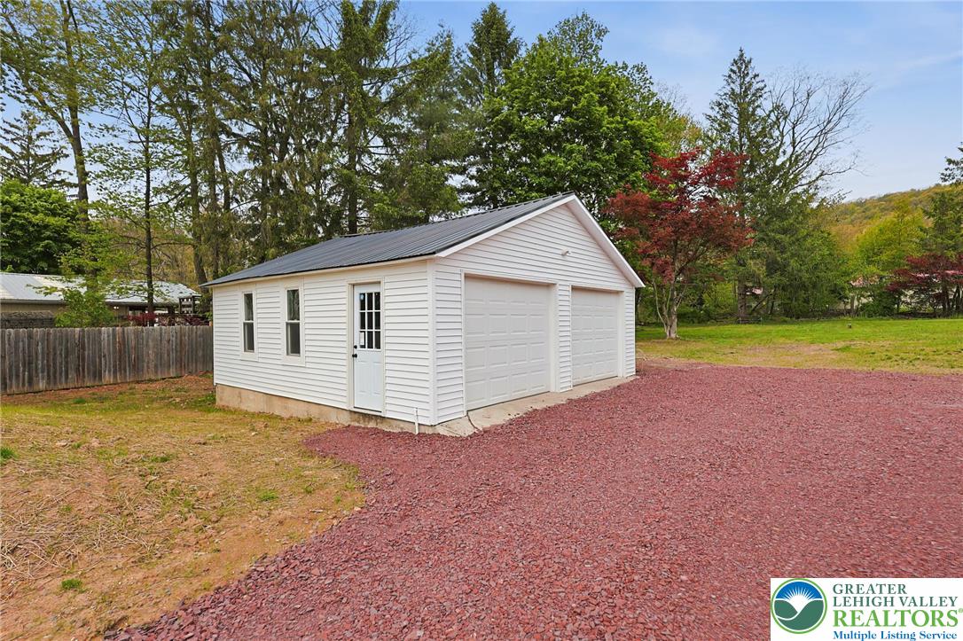 121 Ben Titus Road Tamaqua, PA 18252 - Photo 43 of 48 a view of a house with a yard and a large tree