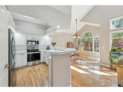 a bathroom with a tub a sink and a mirror