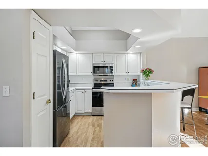 a view of walk in closet with clothes