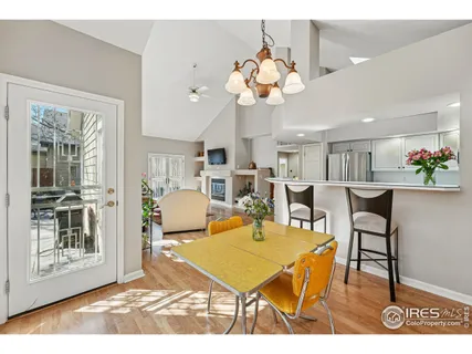a view of a patio with table and chairs and potted plants