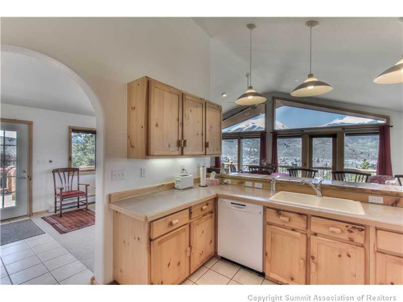 48 H Road Silverthorne, CO 80498 - Photo 7 of 18 a kitchen with a sink stove and cabinets