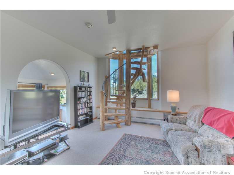 48 H Road Silverthorne, CO 80498 - Photo 8 of 18 a living room with furniture a flat screen tv and a large window