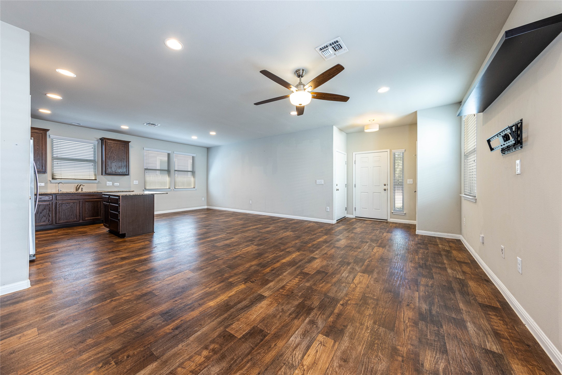 368 Wapiti Road Buda, TX 78610 - Photo 4 of 20 Open-concept living area featuring wood-finish flooring, recessed lighting, and a ceiling fan