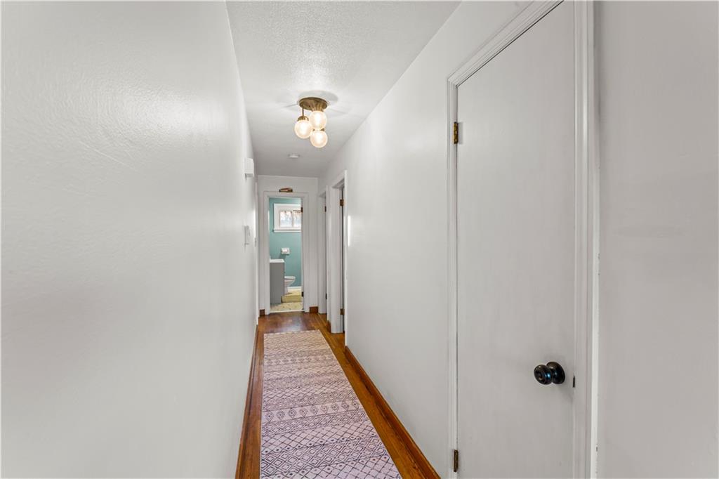 35 Lagonda Road Washington, PA 15301 - Photo 13 of 34 a view of a hallway with wooden floor and a glass door