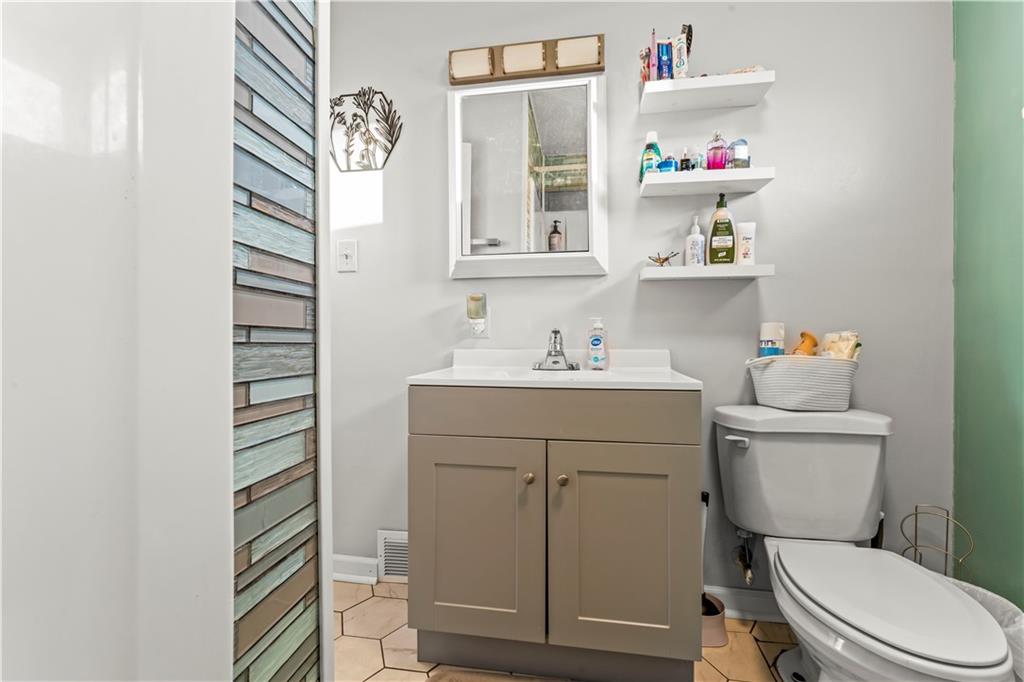 35 Lagonda Road Washington, PA 15301 - Photo 21 of 34 a bathroom with a sink vanity mirror and toilet