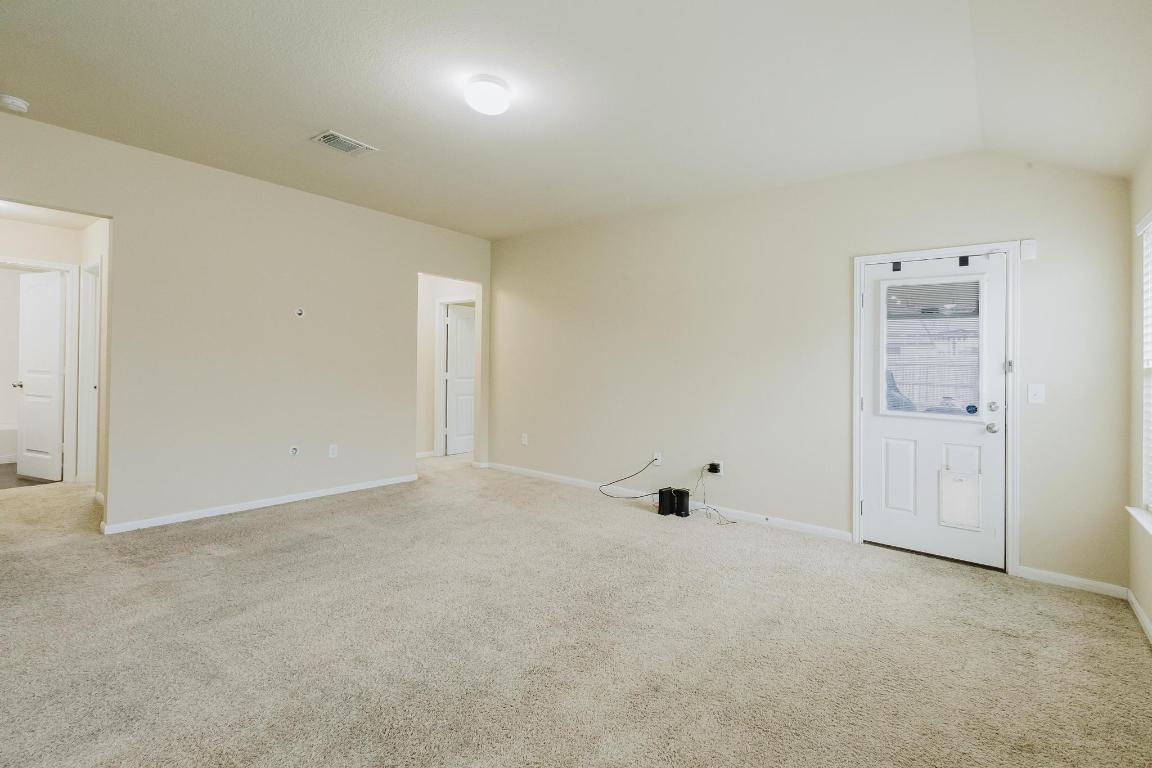 184 Voss Kyle, TX 78640 - Photo 12 of 30 an empty room with white wall and closet