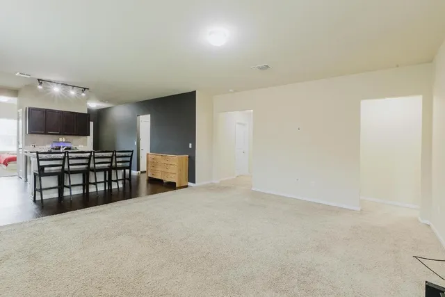 a kitchen with stainless steel appliances kitchen island granite countertop a sink and cabinets