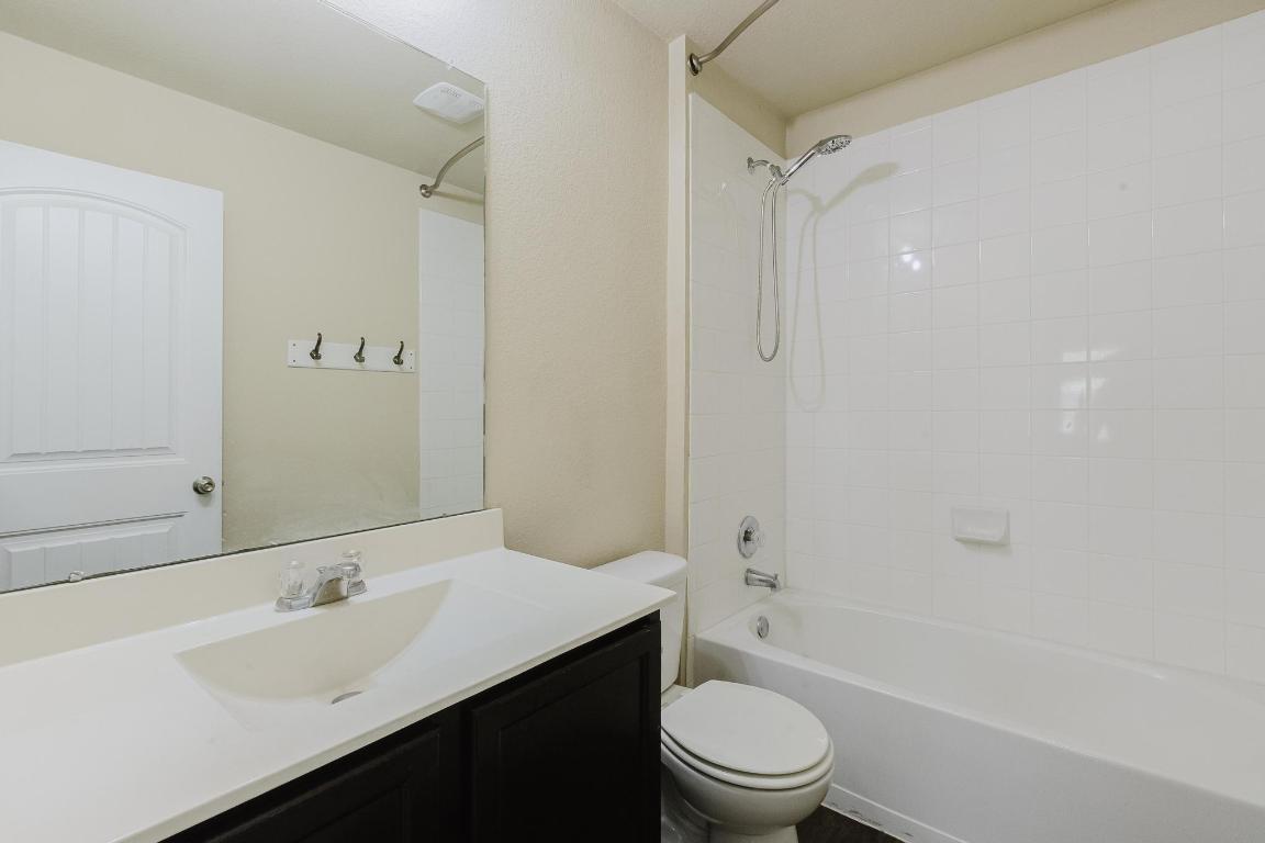 184 Voss Kyle, TX 78640 - Photo 22 of 30 a bathroom with a sink a toilet and shower