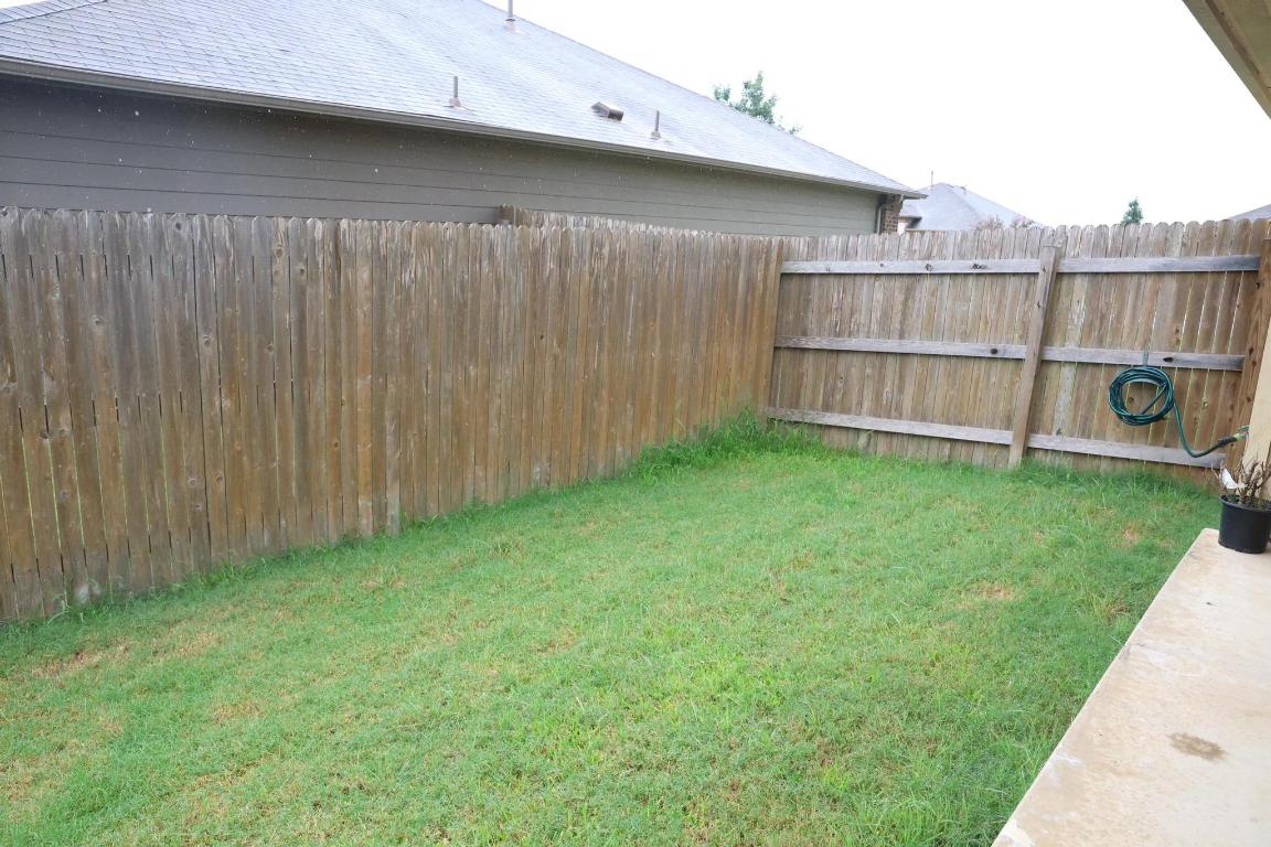 184 Voss Kyle, TX 78640 - Photo 29 of 30 a view of a backyard with a wooden fence