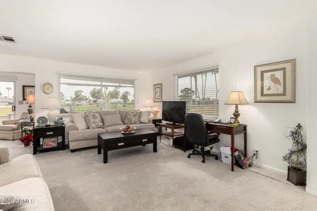 a living room with furniture and a window