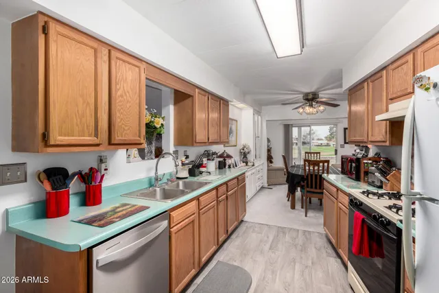a kitchen with lots of counter top space and a sink