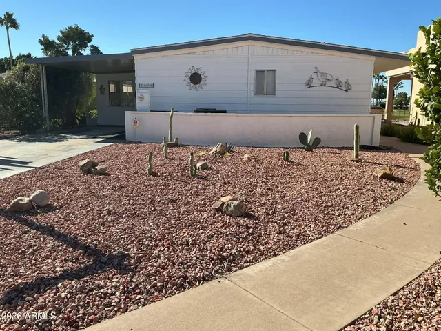 a view of a backyard of the house