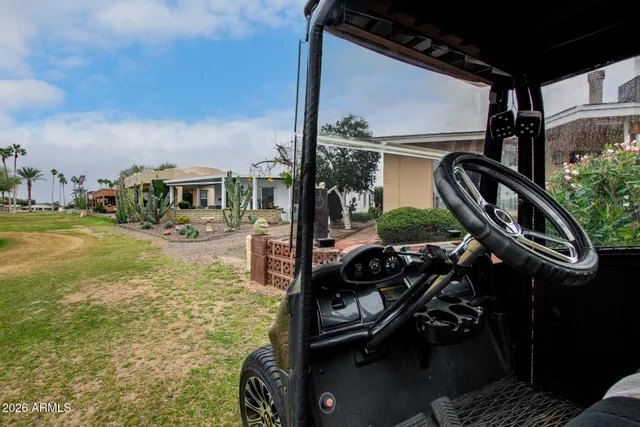 a view of swimming pool with seating area and furniture