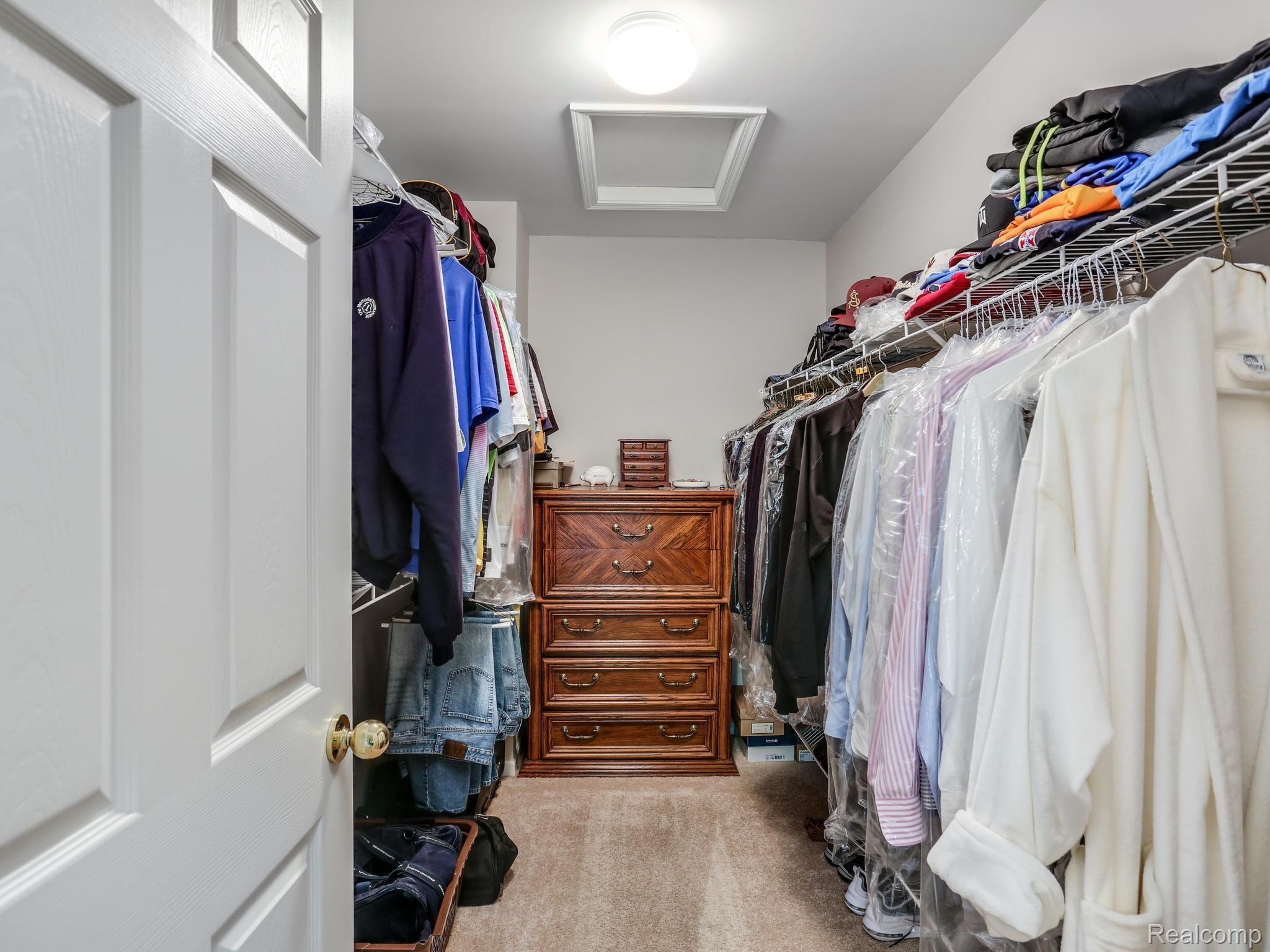 4546 Woodcliff Court Rochester, MI 48306 - Photo 30 of 43 His Master Walk-in Closet