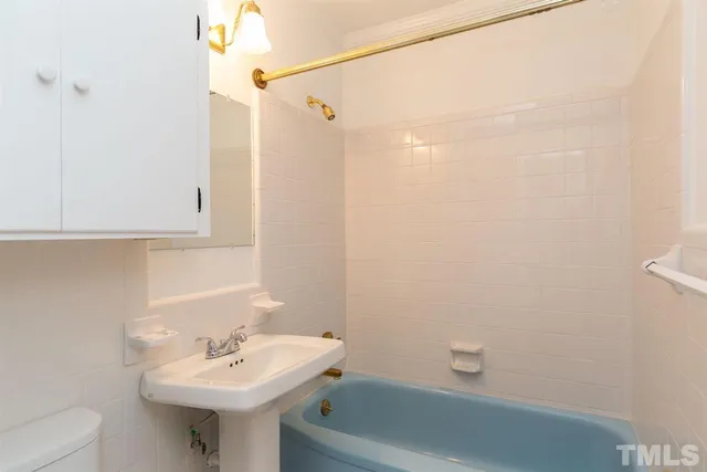 a view of deck with wooden fence and trees