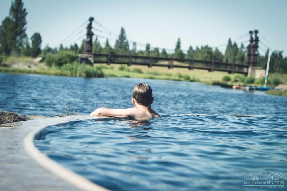 144 Sunstone Loop Bend, OR 97707 - Photo 8 of 24 The Quarry Pool offers lakeside swimming