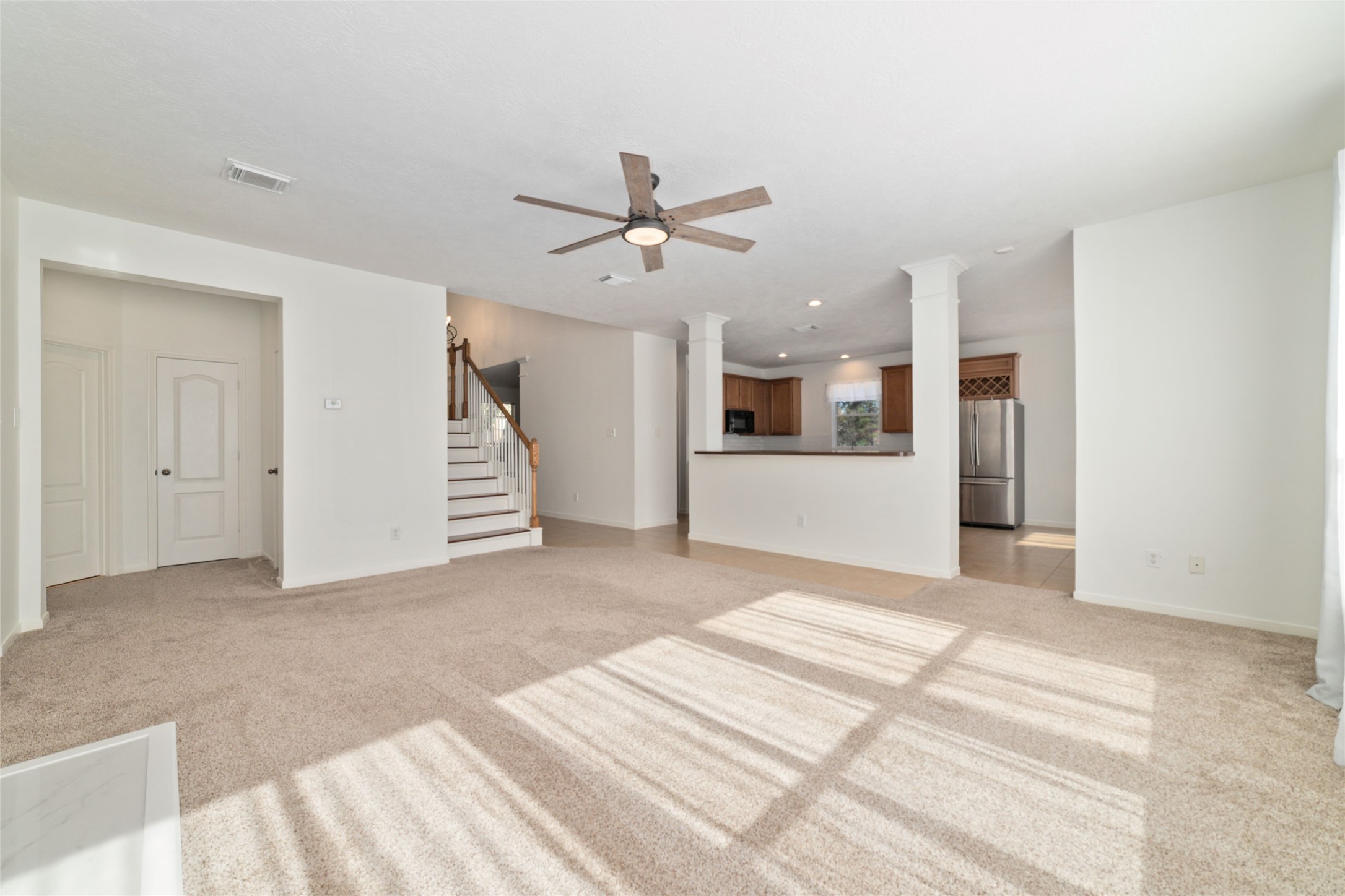 2618 Bridgestone Park Lane Spring, TX 77386 - Photo 14 of 49 Looking into the kitchen from the living room you'll notice the open-concept layout of the area that is perfect for entertaining.
