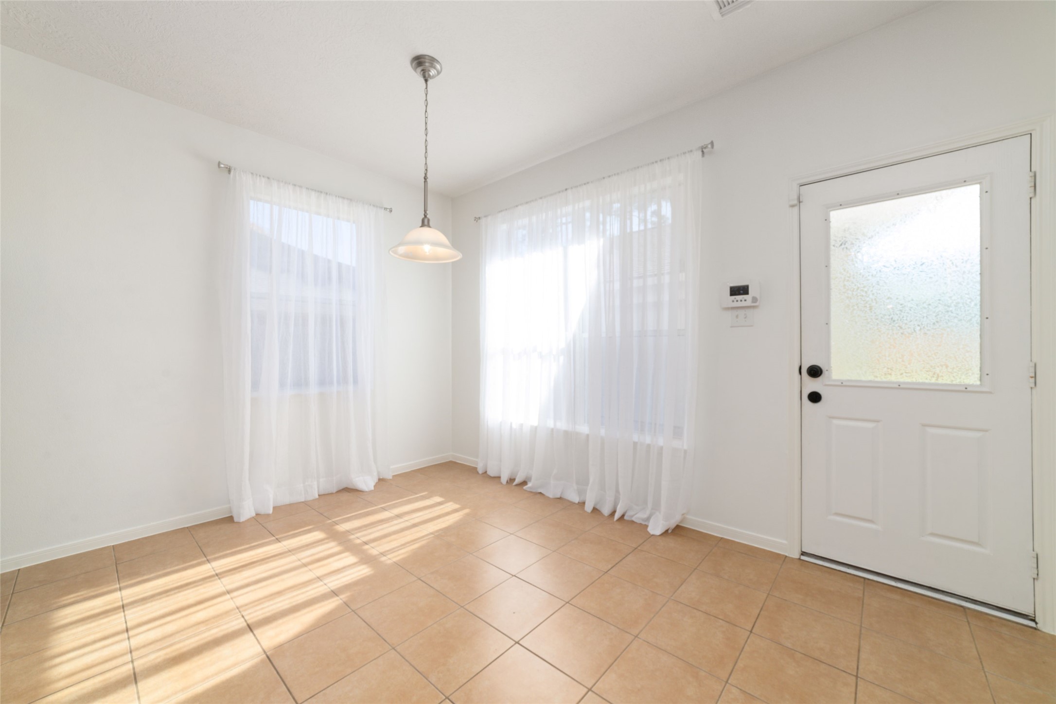2618 Bridgestone Park Lane Spring, TX 77386 - Photo 20 of 49 Entering the breakfast area, you are immediately greeted by abundant natural light. Door leads you to the backyard with a covered walkway to the garage.