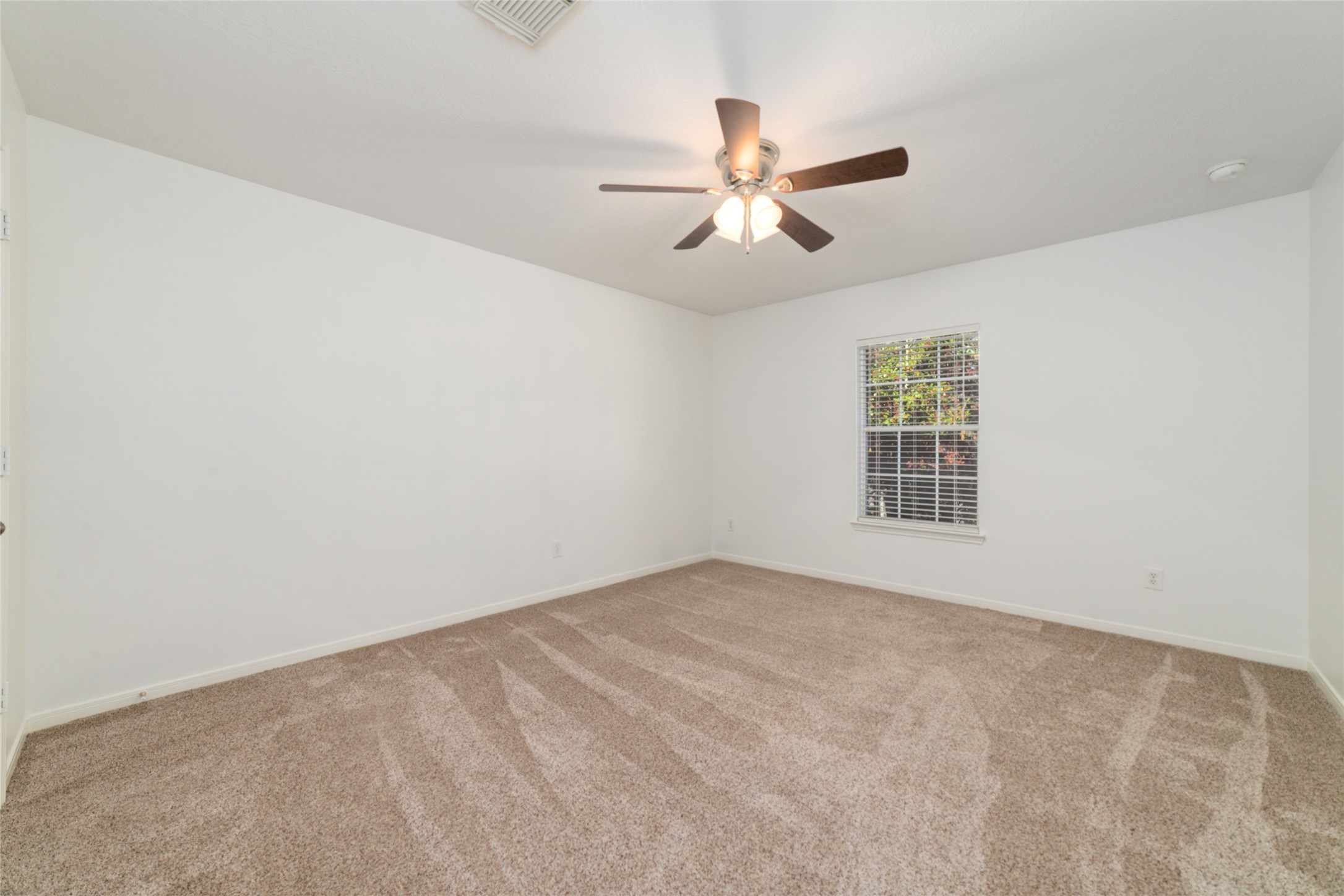 2618 Bridgestone Park Lane Spring, TX 77386 - Photo 38 of 49 Another secondary bedroom offers a comfortable size and benefits from north-facing natural light.