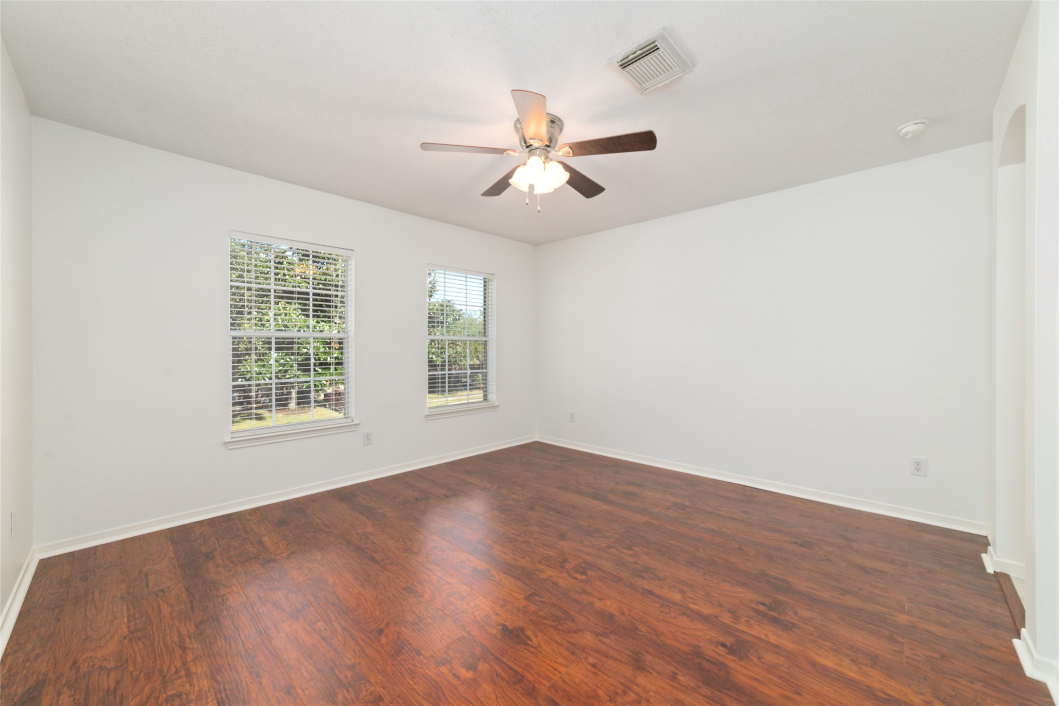 2618 Bridgestone Park Lane Spring, TX 77386 - Photo 43 of 49 The final fifth bedroom on the second floor offers continued laminate flooring, two north-facing windows, and a walk-in closet.