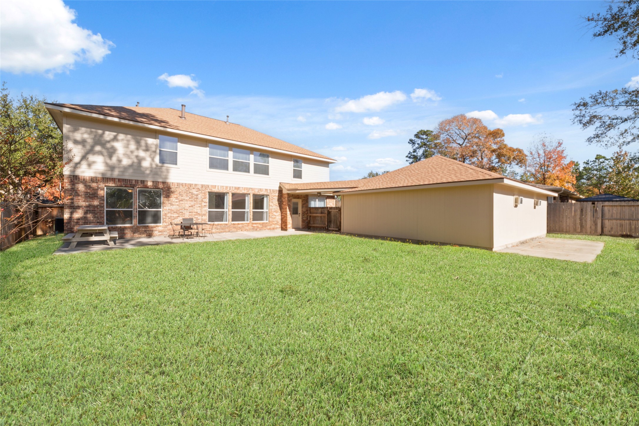 2618 Bridgestone Park Lane Spring, TX 77386 - Photo 48 of 49 An additional concrete slab behind the garage provides convenient space for storing lawn equipment or firewood. Two window units seen here in the garage help maintain a comfortable environment in your temperature-controlled garage.