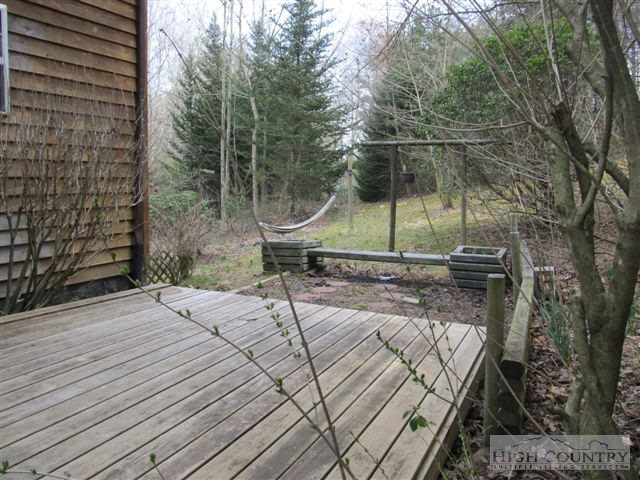 3192 Wildcat Road Deep Gap, NC 28618 - Photo 11 of 24 a view of a wooden deck with a backyard