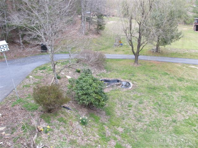3192 Wildcat Road Deep Gap, NC 28618 - Photo 12 of 24 a backyard of a house with lots of green space